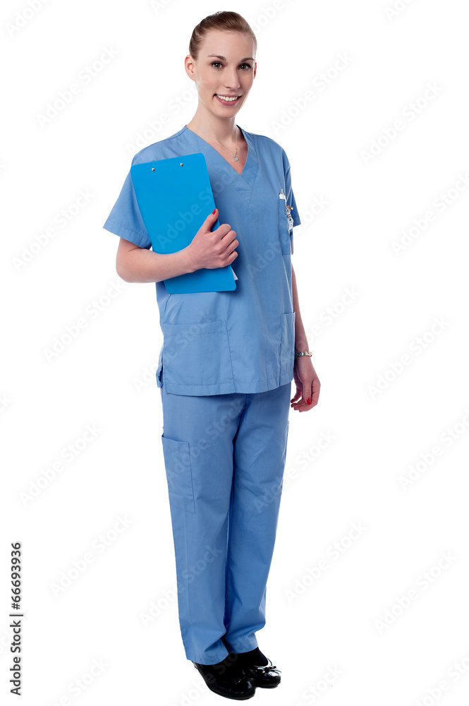 Young nurse holding clipboard Young nurse holding clipboard
