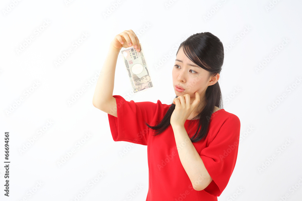 一万円を持って悩む人 一万円を持って悩む人