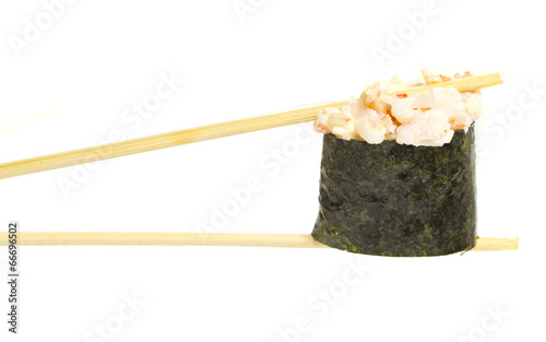 Sushi gunklan in chopsticks isolated on white background