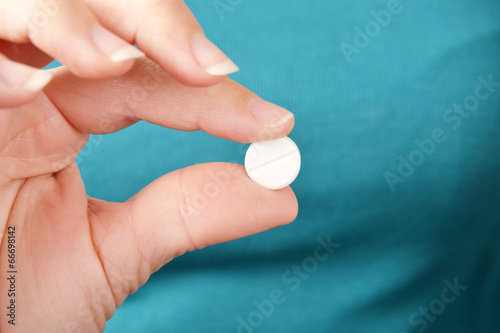 woman showing a pill