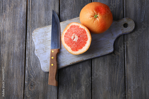 Ripe grapefruits and knife