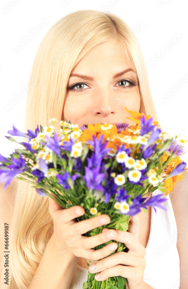 Young beautiful woman with flowers close up