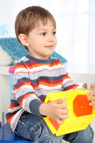 Cute little boy playing in ...