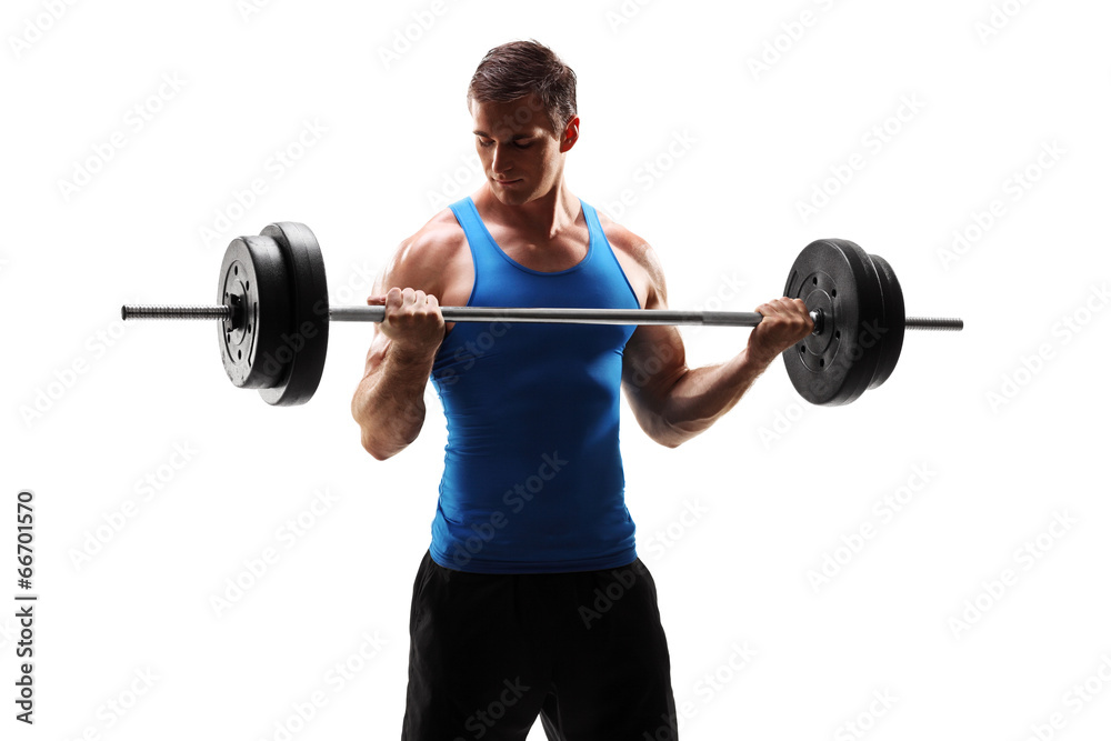 Muscular young man exercising with a barbell Muscular young man exercising with a barbell