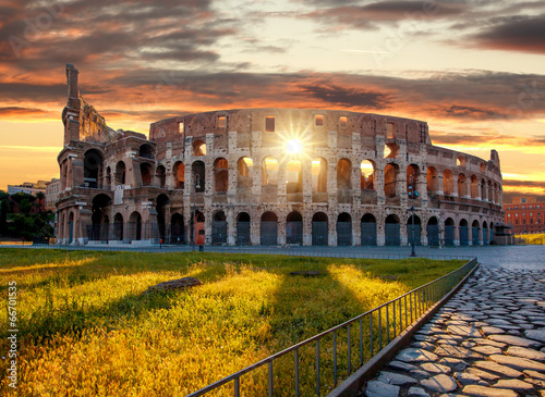 Colosseum against sunrise time in Rome, Italy photo