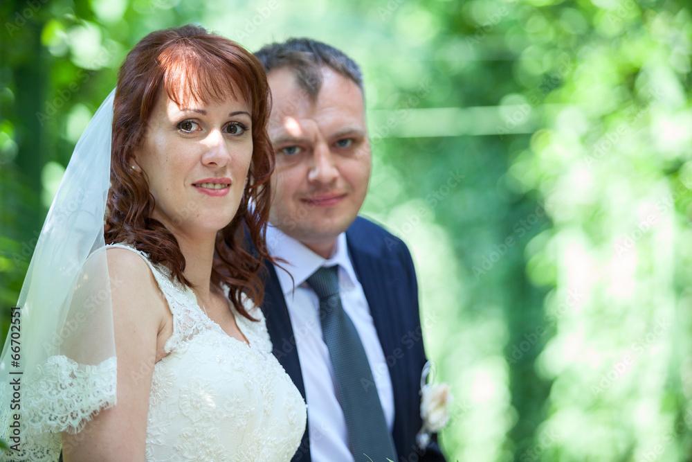 Head and shoulders portrait of young wedding couple Head and shoulders portrait of young wedding couple