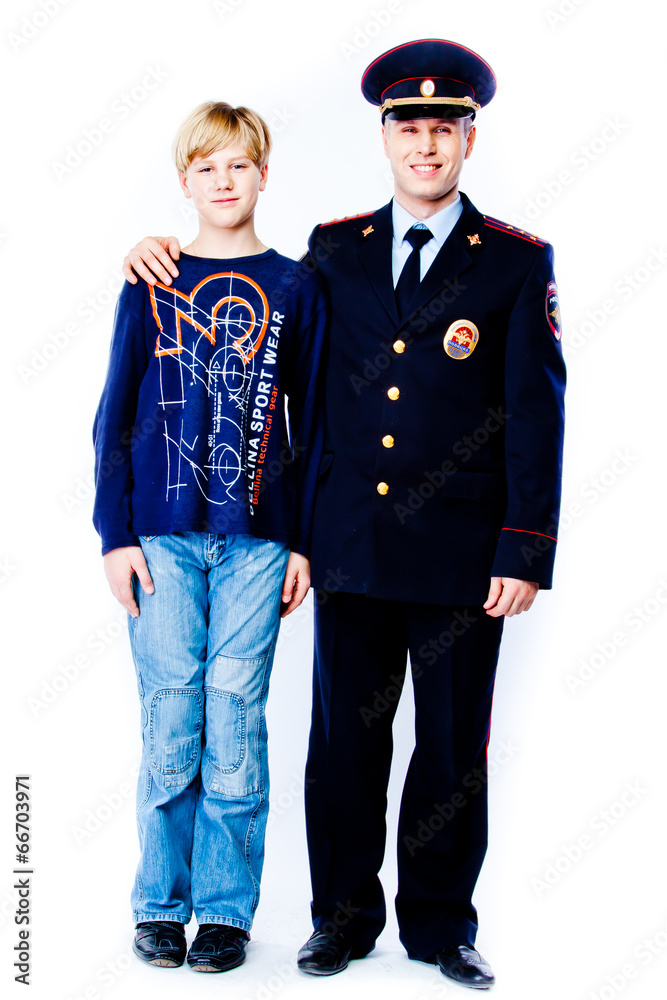 boy stands next to the police boy stands next to the police
