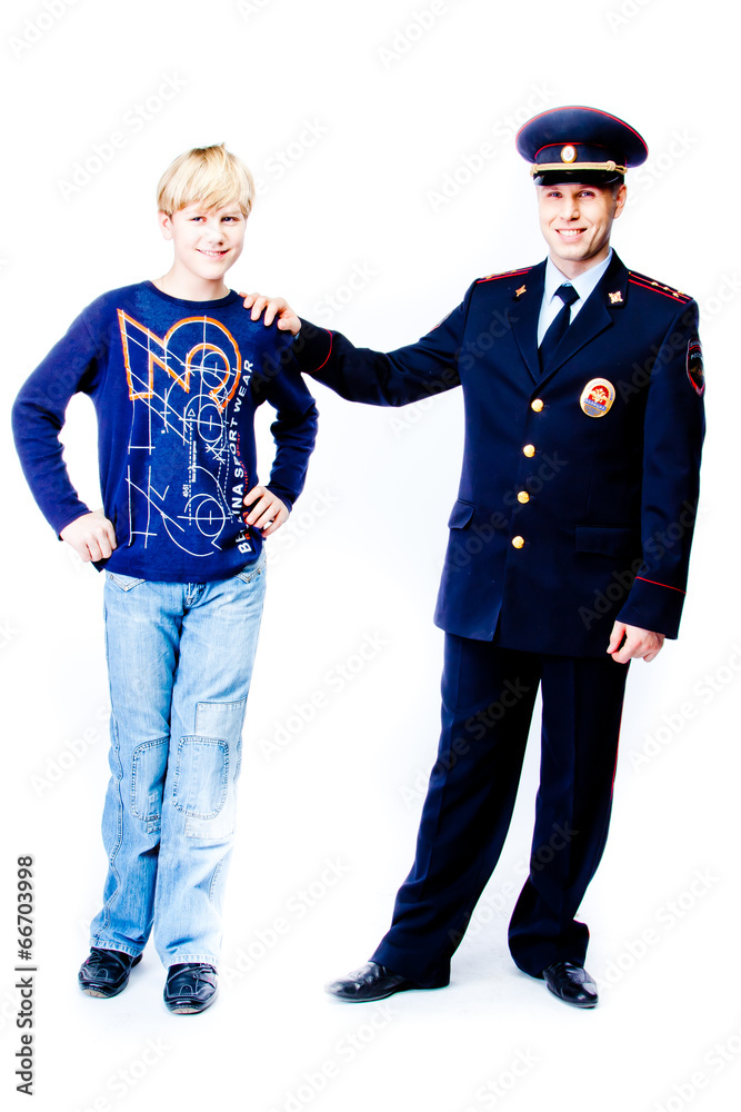 boy stands next to the police boy stands next to the police