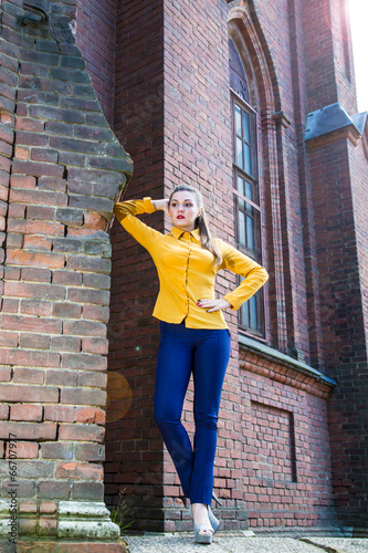 Girl posing in an old cathedral