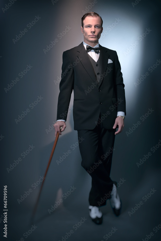 Retro 1920 business fashion man wearing black suit and bow tie. Retro 1920 business fashion man wearing black suit and bow tie.