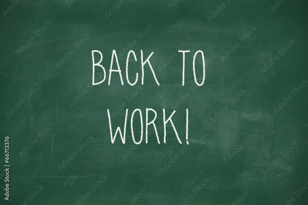Back to work handwritten on blackboard Back to work handwritten on blackboard