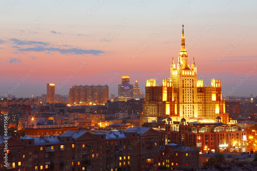 Building of Hotel Ukraine with beautiful illumination at evening