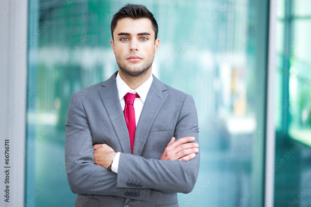 Portrait of an handsome young manager with crossed arms Portrait of an handsome young manager with crossed arms