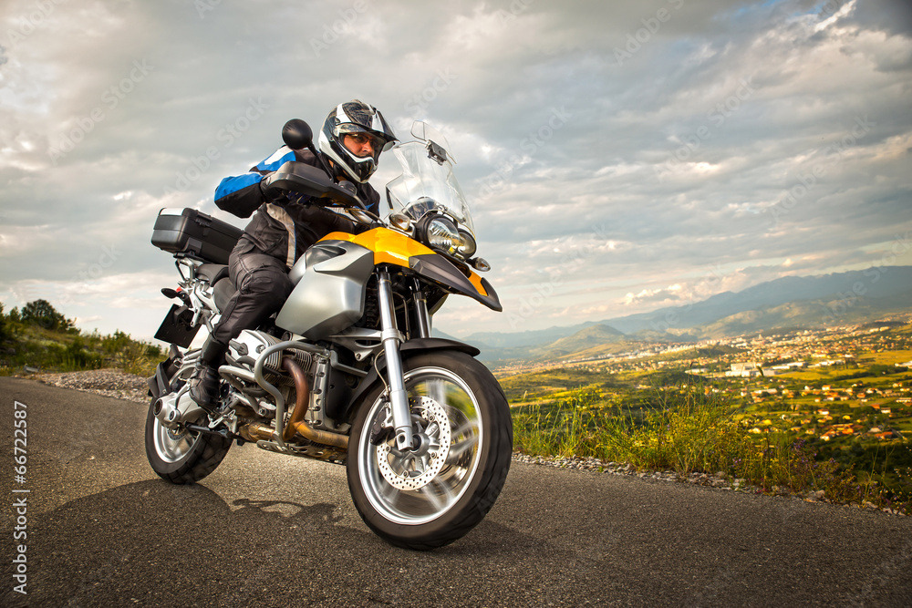 Biker man sits on a bike