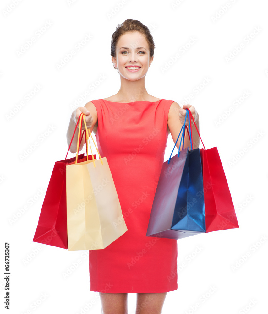 smiling elegant woman in dress with shopping bags smiling elegant woman in dress with shopping bags