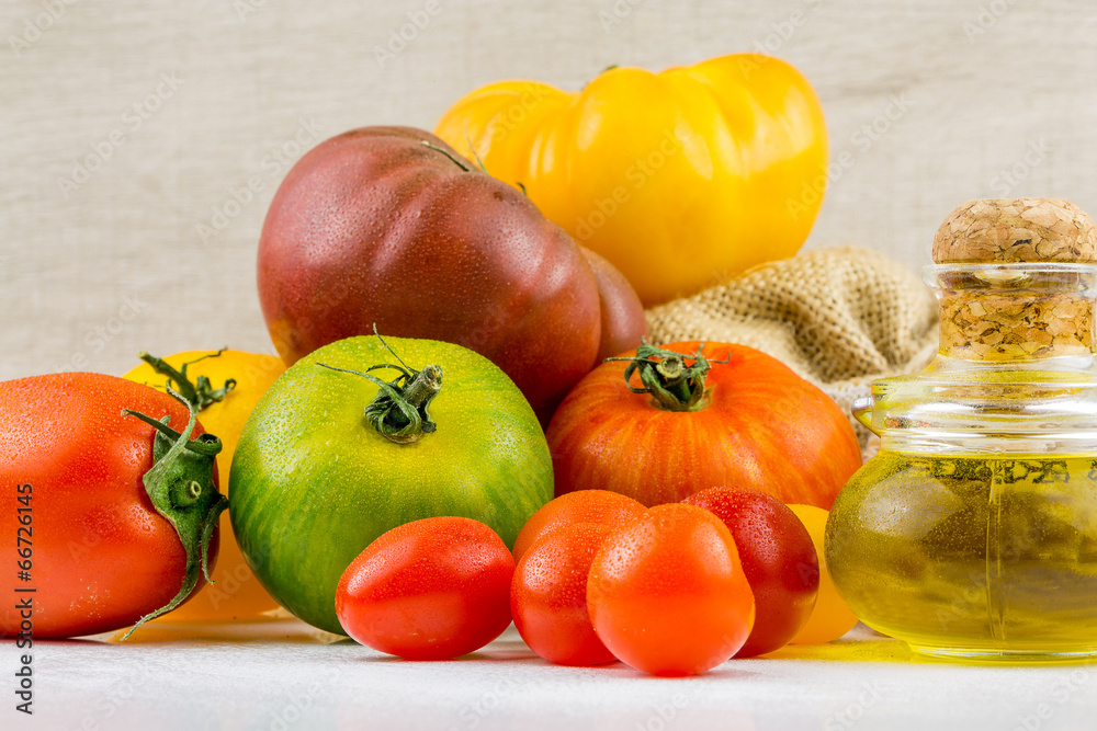 Varieties of colorful tomatos and olive oil Varieties of colorful tomatos and olive oil