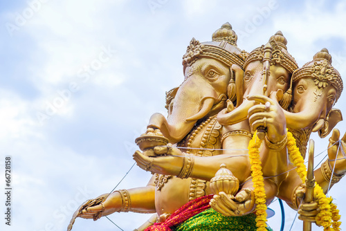 The statute Ganesha outdoor against blue sky and white clouds