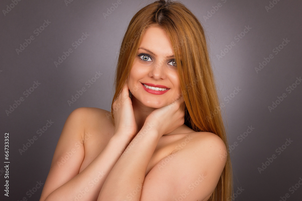 Studio shot of sexy young woman with long blonde hair Studio shot of sexy young woman with long blonde hair