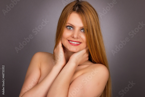 Studio shot of sexy young woman with long blonde hair