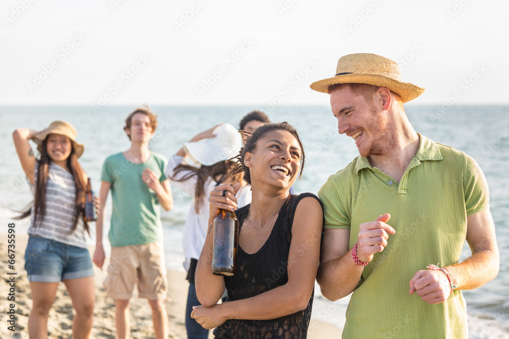 Multiracial Group of Friends Having a Party at Beach - obrazy, fototapety, plakaty 