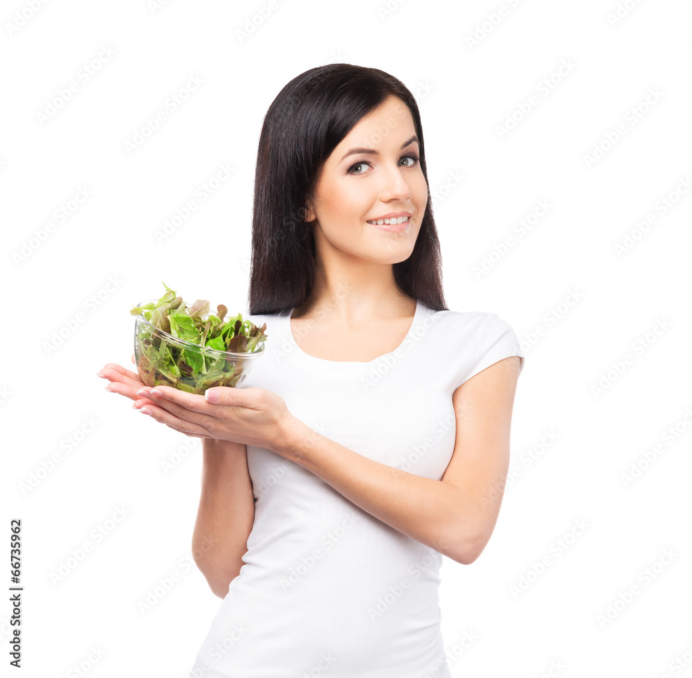 Healthy teenage girl with a bowl of green salad Healthy teenage girl with a bowl of green salad