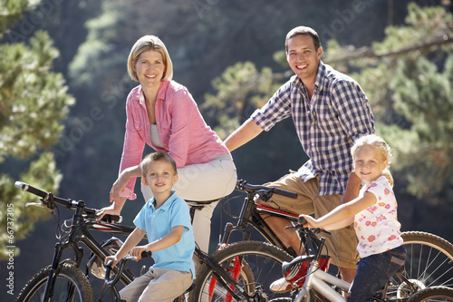 Young family on country bike ride