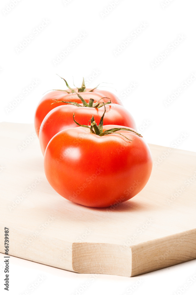 Tomatoes standing in line one after another. Tomatoes standing in line one after another.