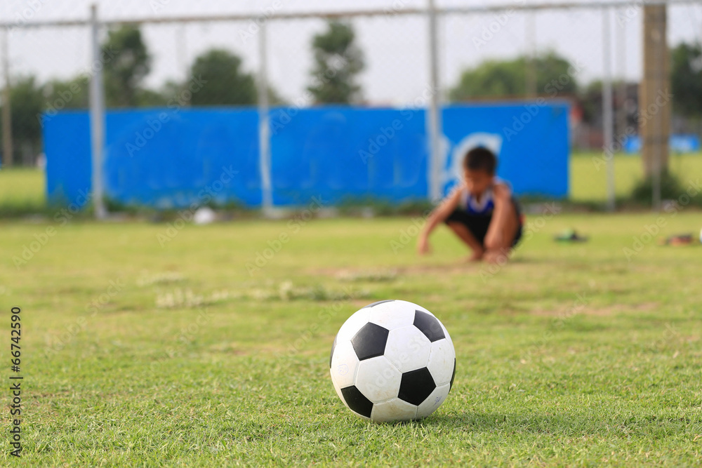 Children playing football on the field