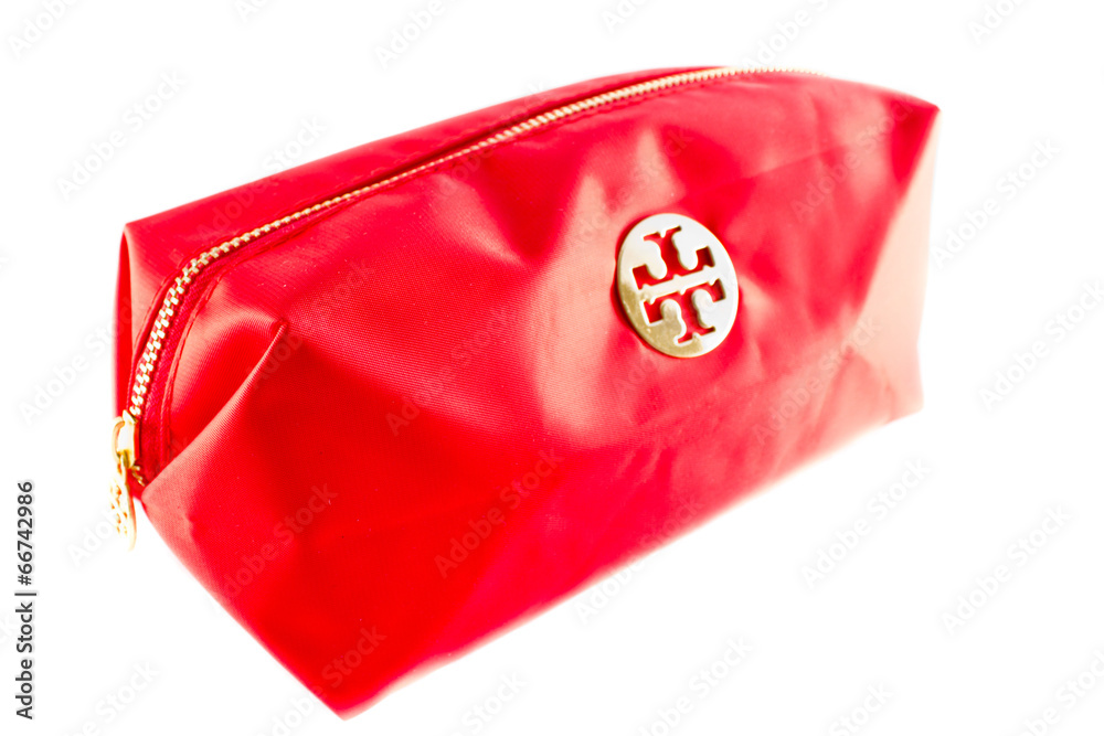 Naklejka premium Red cosmetic bag isolated on a white