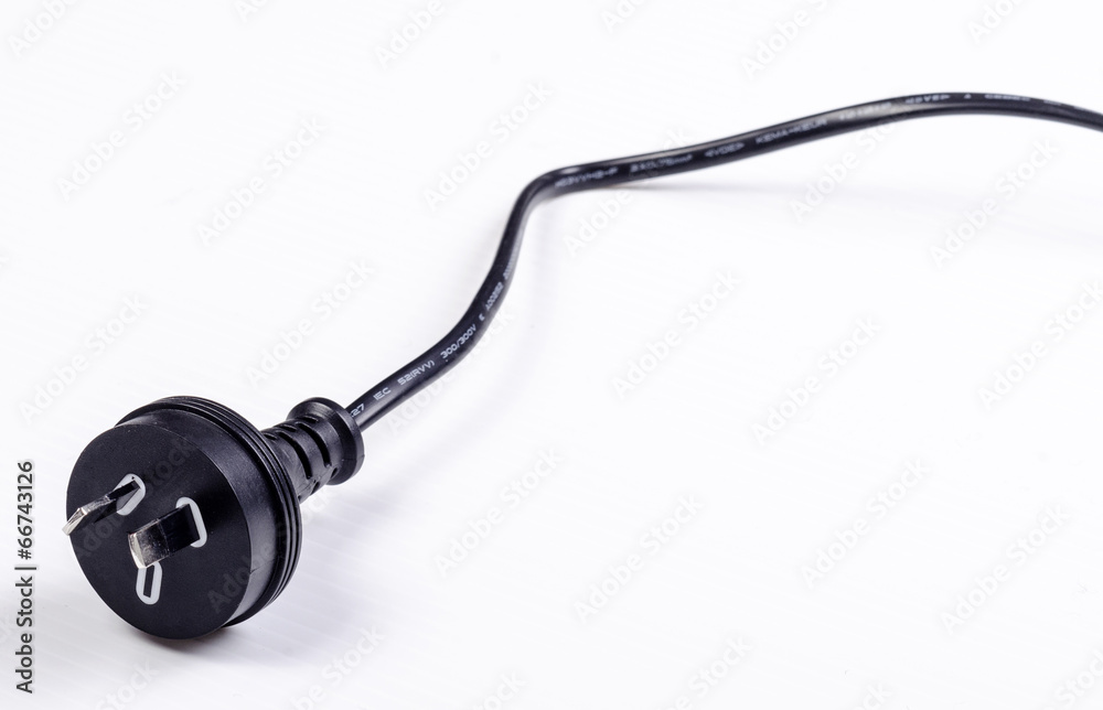 A black Australian power cord plug on white background A black Australian power cord plug on white background