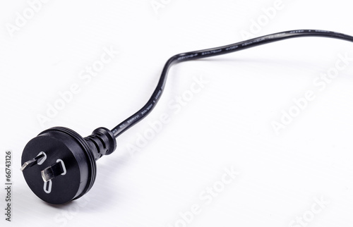 A black Australian power cord plug on white background