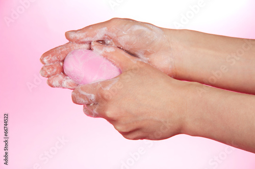 Piece of fragrant soap in the female hands