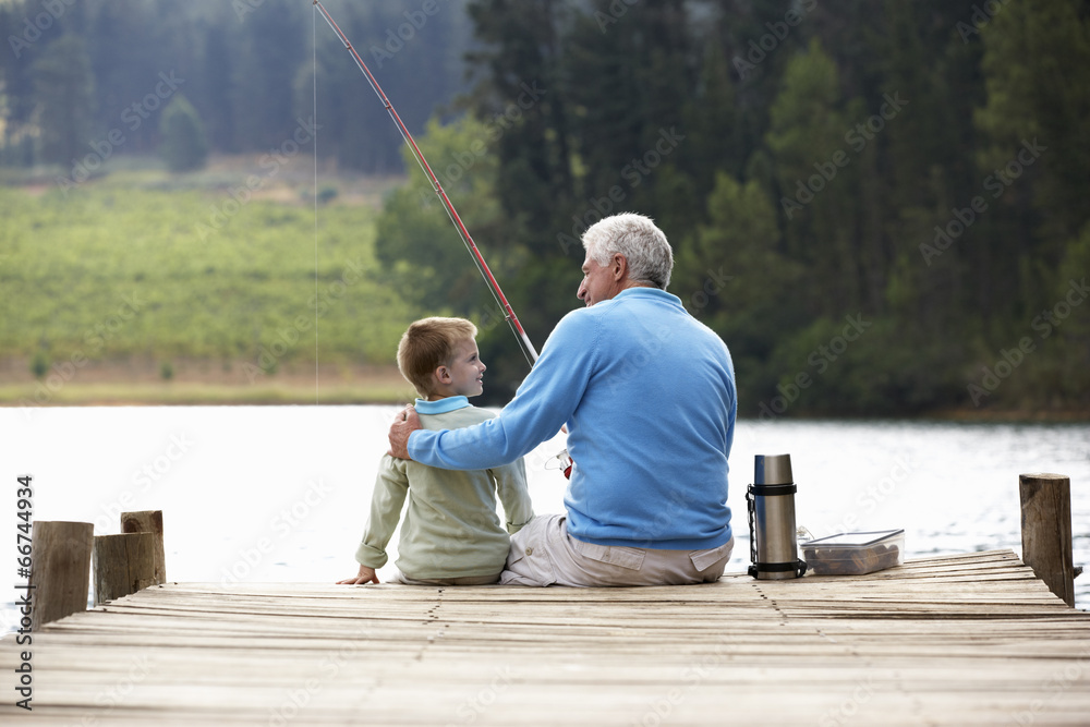 Senior man fishing with grandson Senior man fishing with grandson