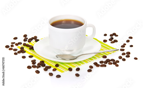 White cup of coffee on striped napkin with grains