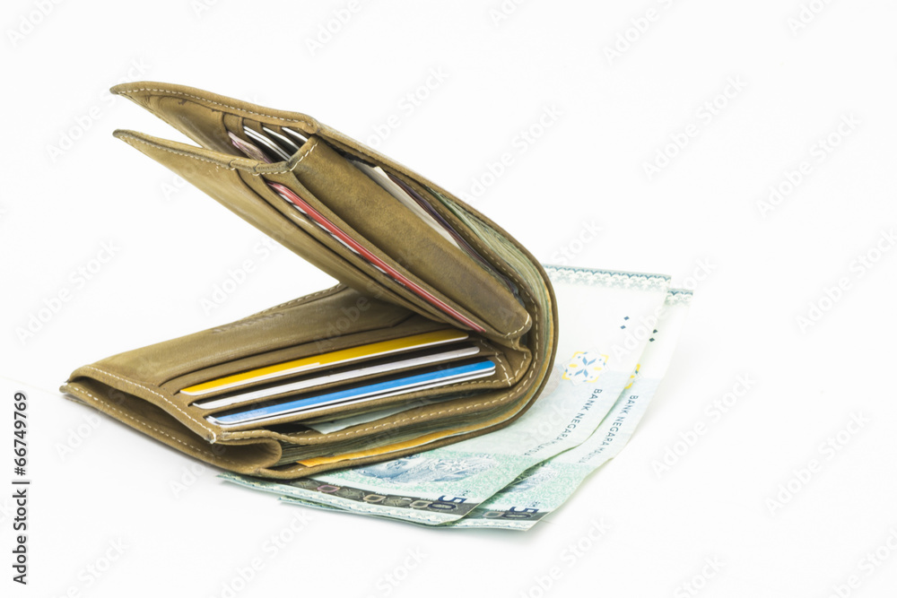 Isolated wallet on bank notes with white background Isolated wallet on bank notes with white background