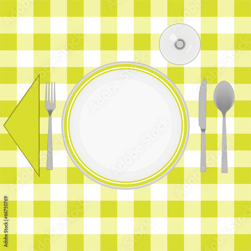 Yellow cloth table with cutlery