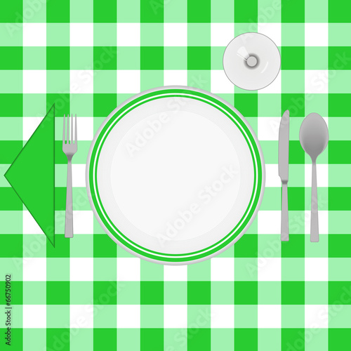Green cloth table with cutlery