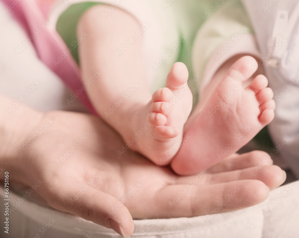 Baby feet in mother hand Baby feet in mother hand