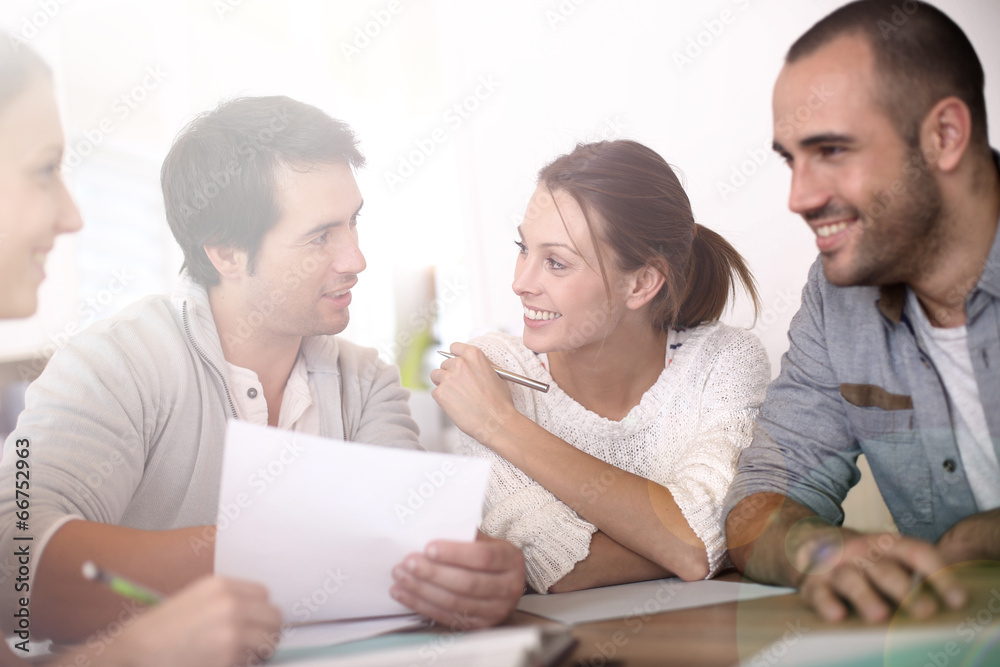 Group of business people in office working on project Group of business people in office working on project