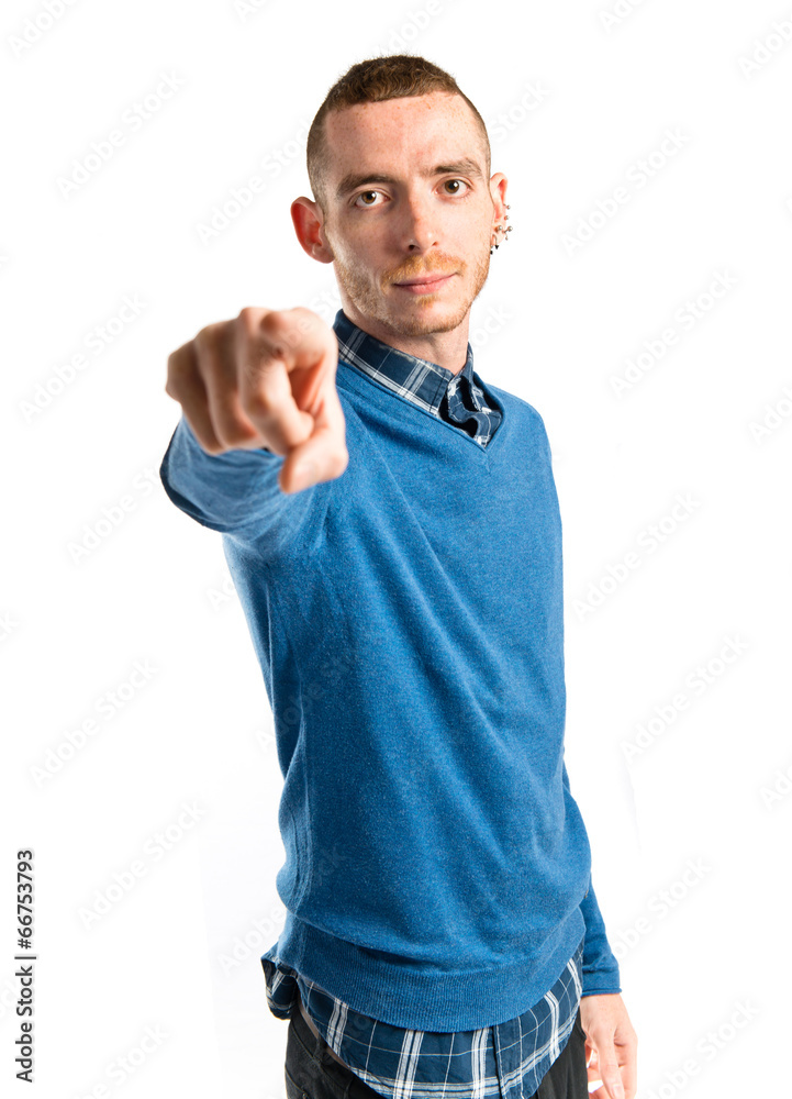 Young man pointing over isolated white background Young man pointing over isolated white background