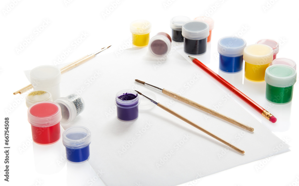 Paints, brushes and pencil on the paper Paints, brushes and pencil on the paper