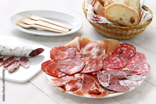 various types of  spanish salami, sausage and ham. photo