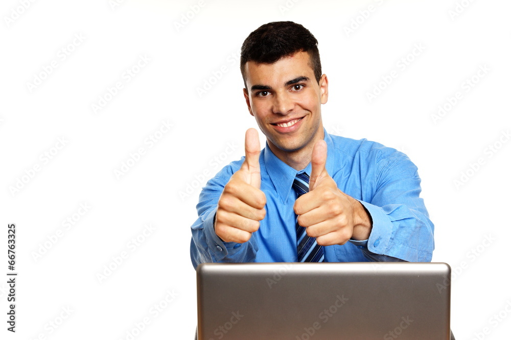 Young businessman shows thumbs up, left you can write some text Young businessman shows thumbs up, left you can write some text