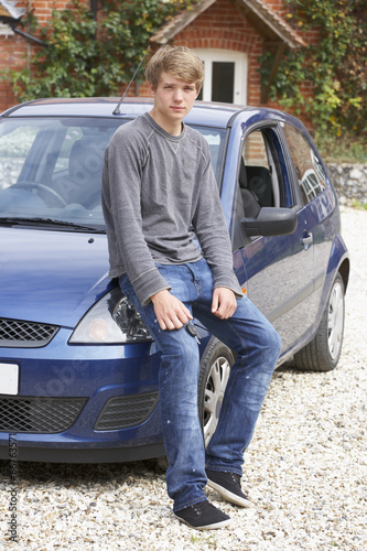Young man with car © Monkey Business