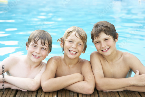 Boys in outdoor swimming pool © Monkey Business
