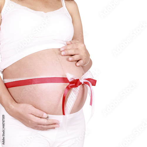Wallpaper Mural Belly of a pregnant woman and  ribbon with clipping paths Torontodigital.ca