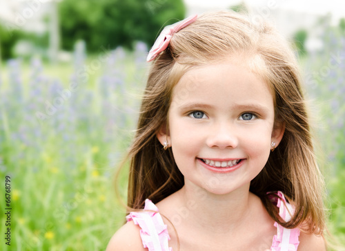 Billede på lærred Portrait of adorable smiling little girl