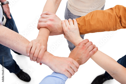 Friends Linking Hands In Team