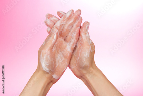 Foam of soap on female hands