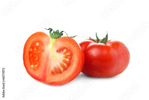 Tomato and half slice on white background